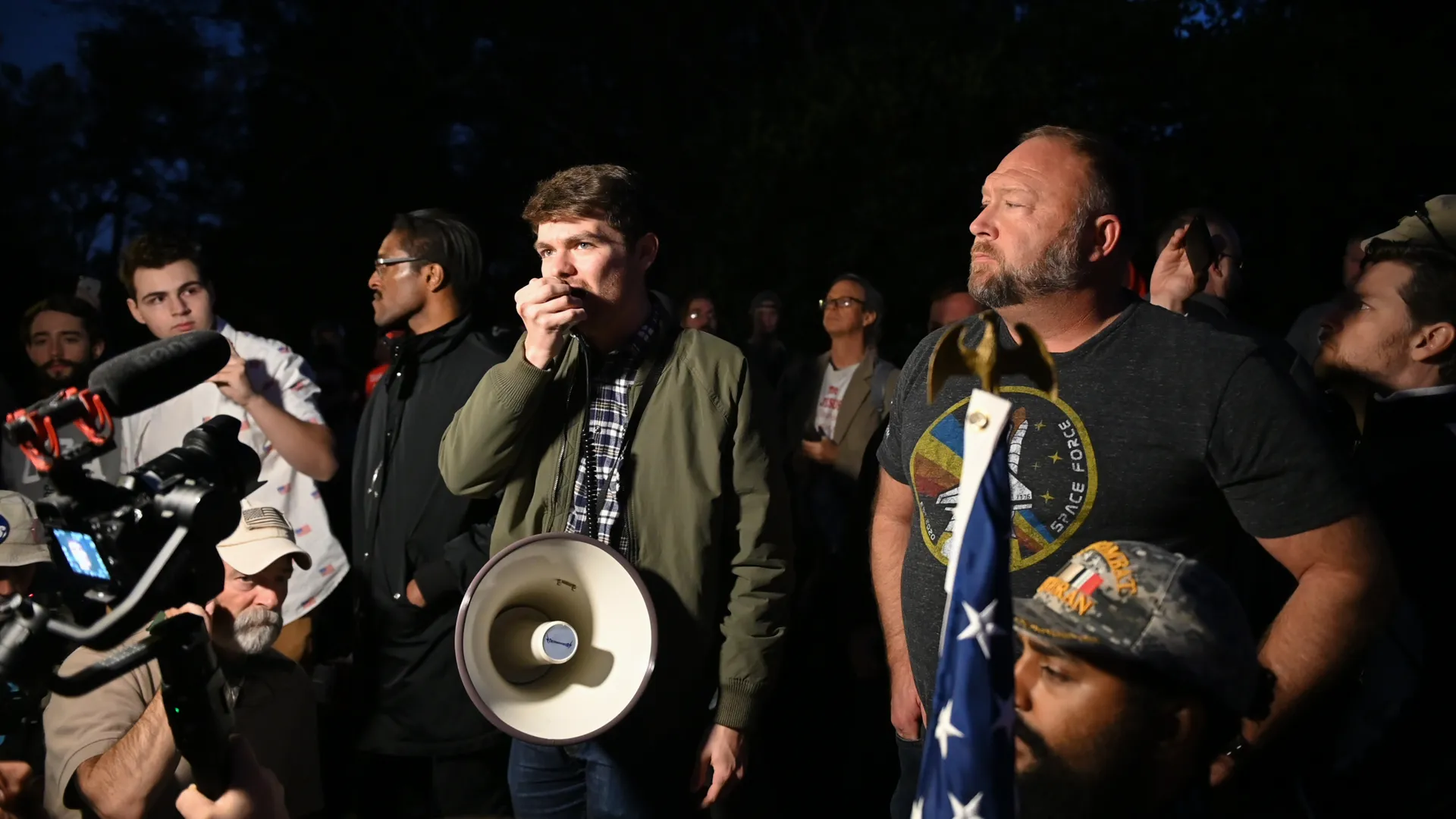 Charlie Kirk next to Alex Jones