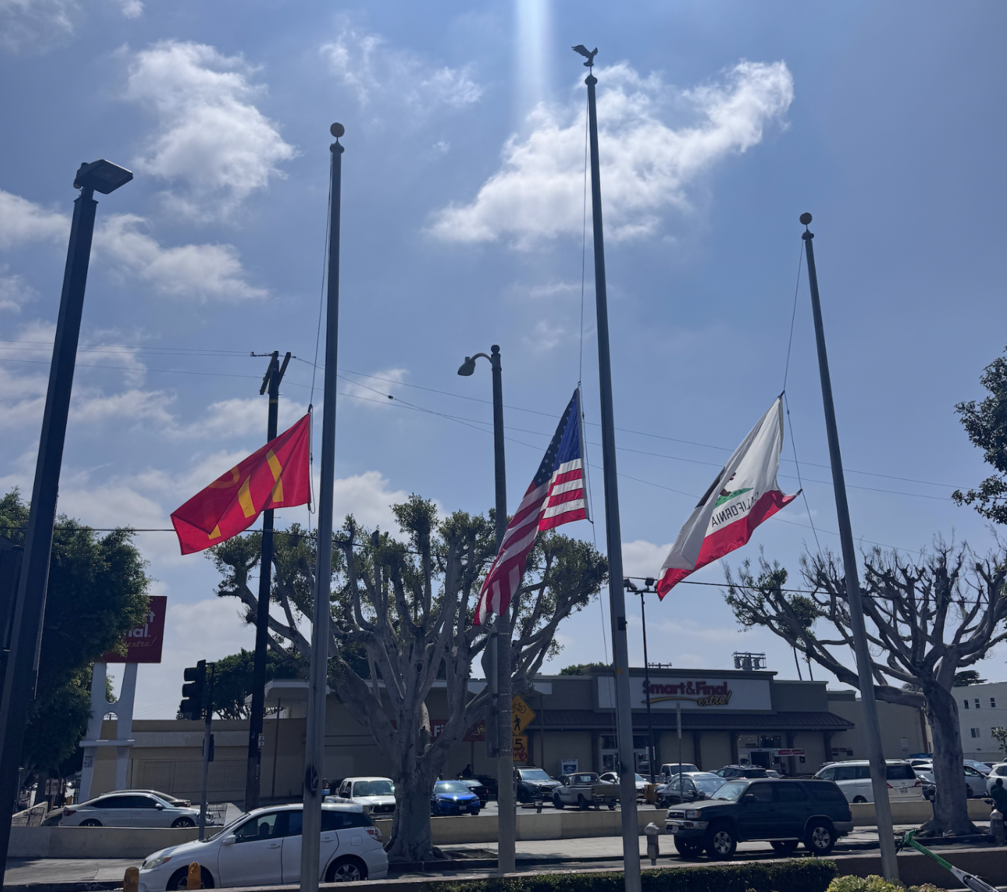 3 flags at half mast