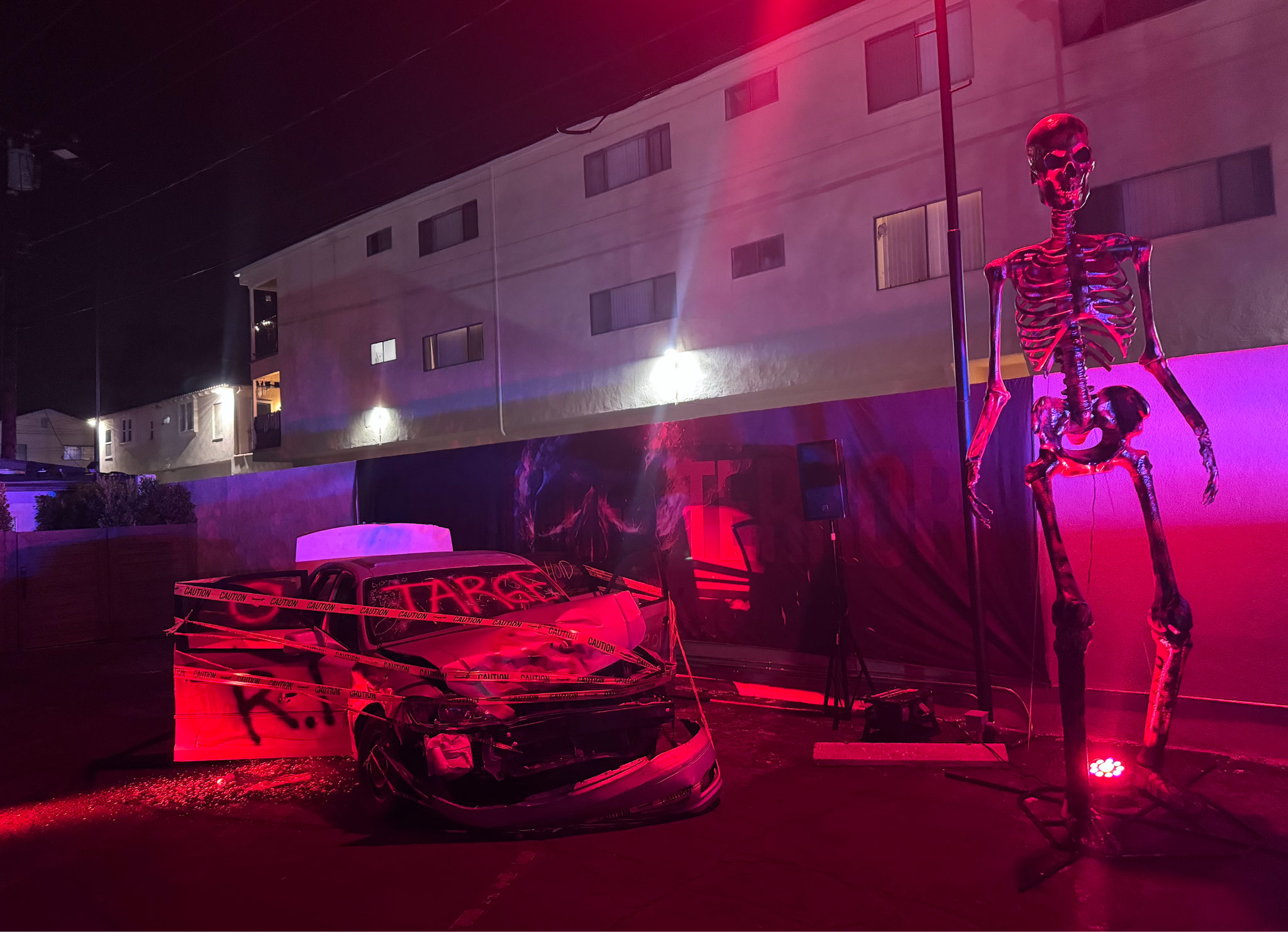 A car crash set and a giant skeleton