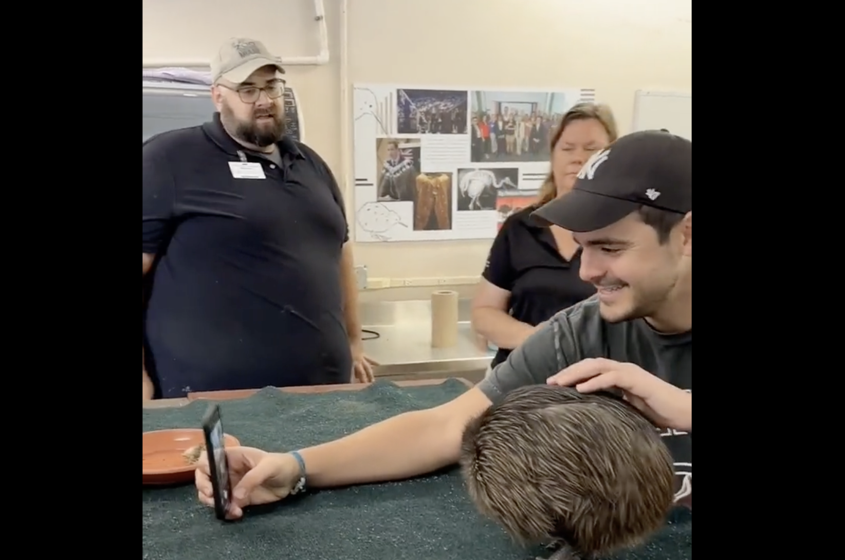 American man mugging next to a kiwi taking a selfie in daylight