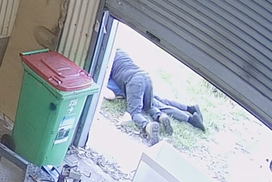 Man lying on top of fake seizure guy