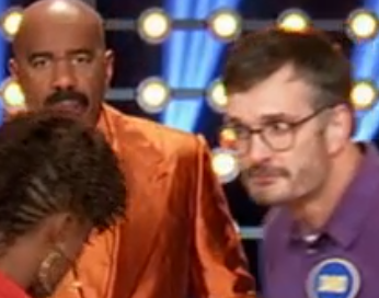 My death stare at Shaina, as Steve Harvey stares in background at both of us