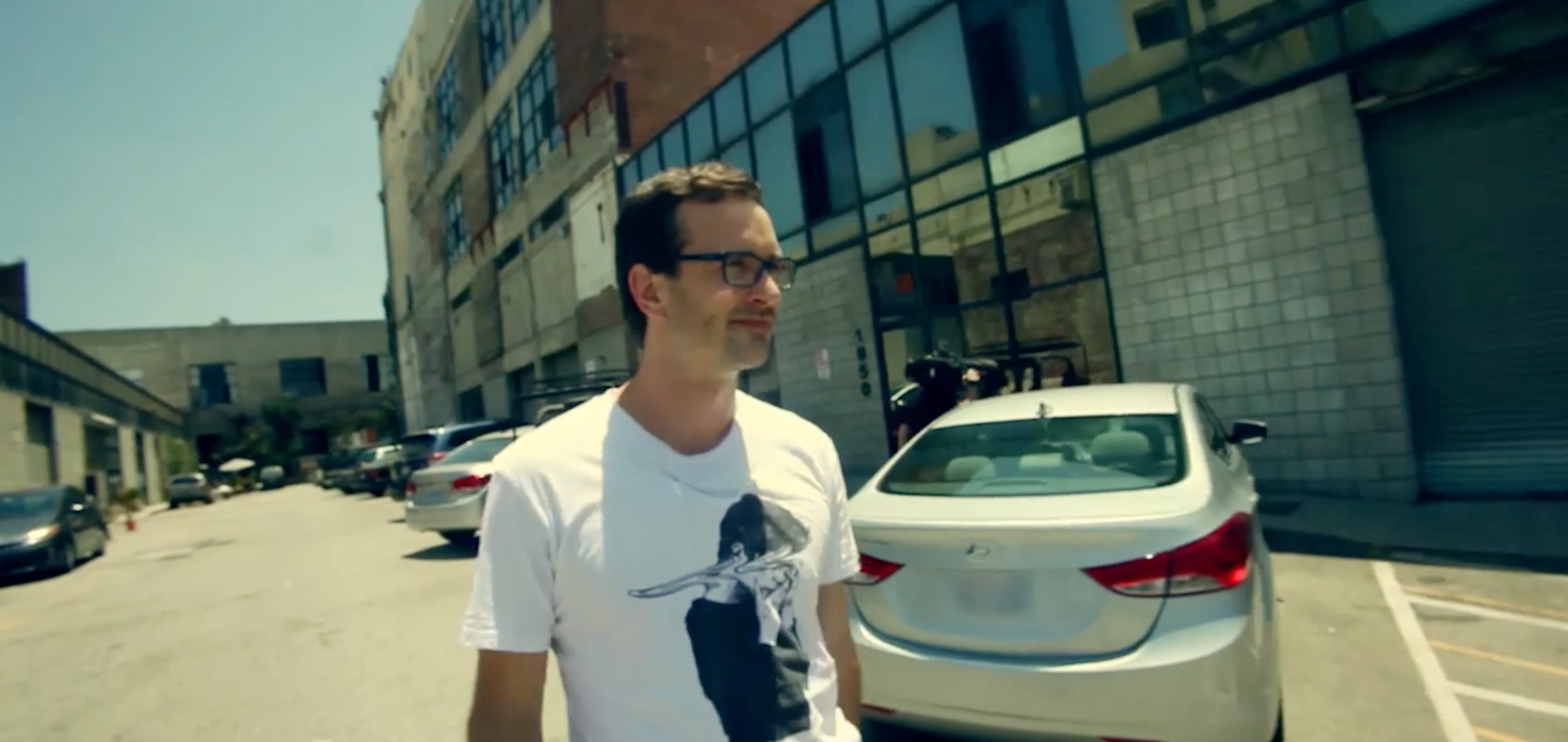 I wear the warped face tee as I walk away. dejected, from the tickling studio in Tickled
