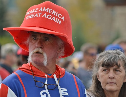 A man in a Make American Great Again hat