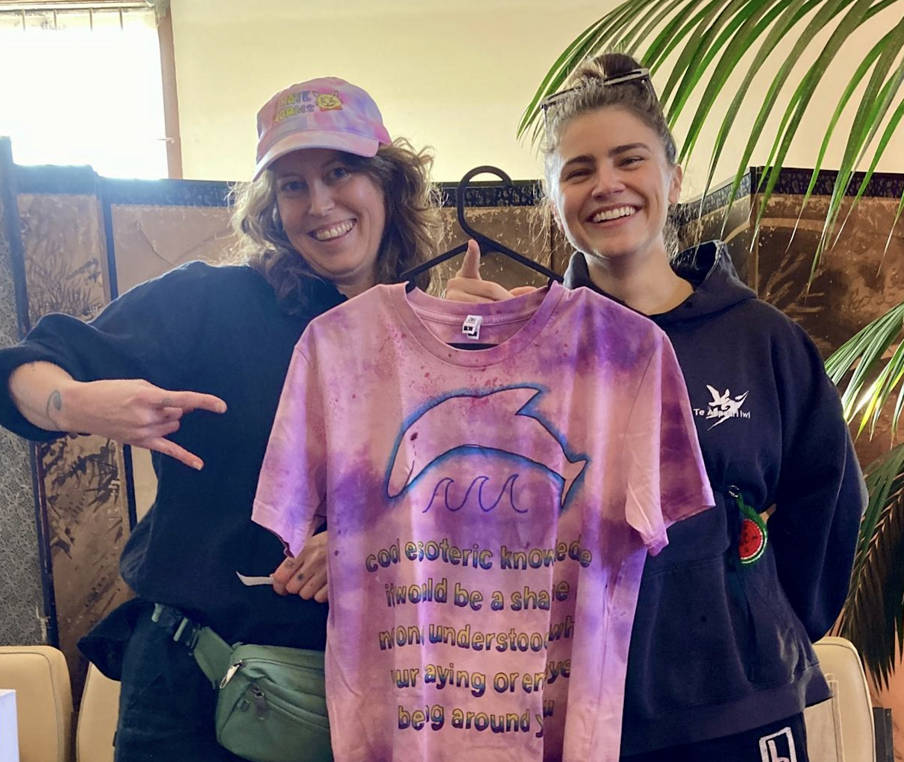 Mitch and Chloe standing with a tee shirt