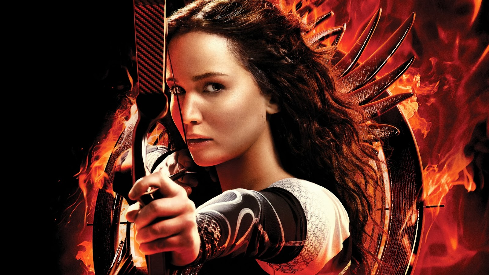 The hero from Hunger Games holding a bow n arrow
