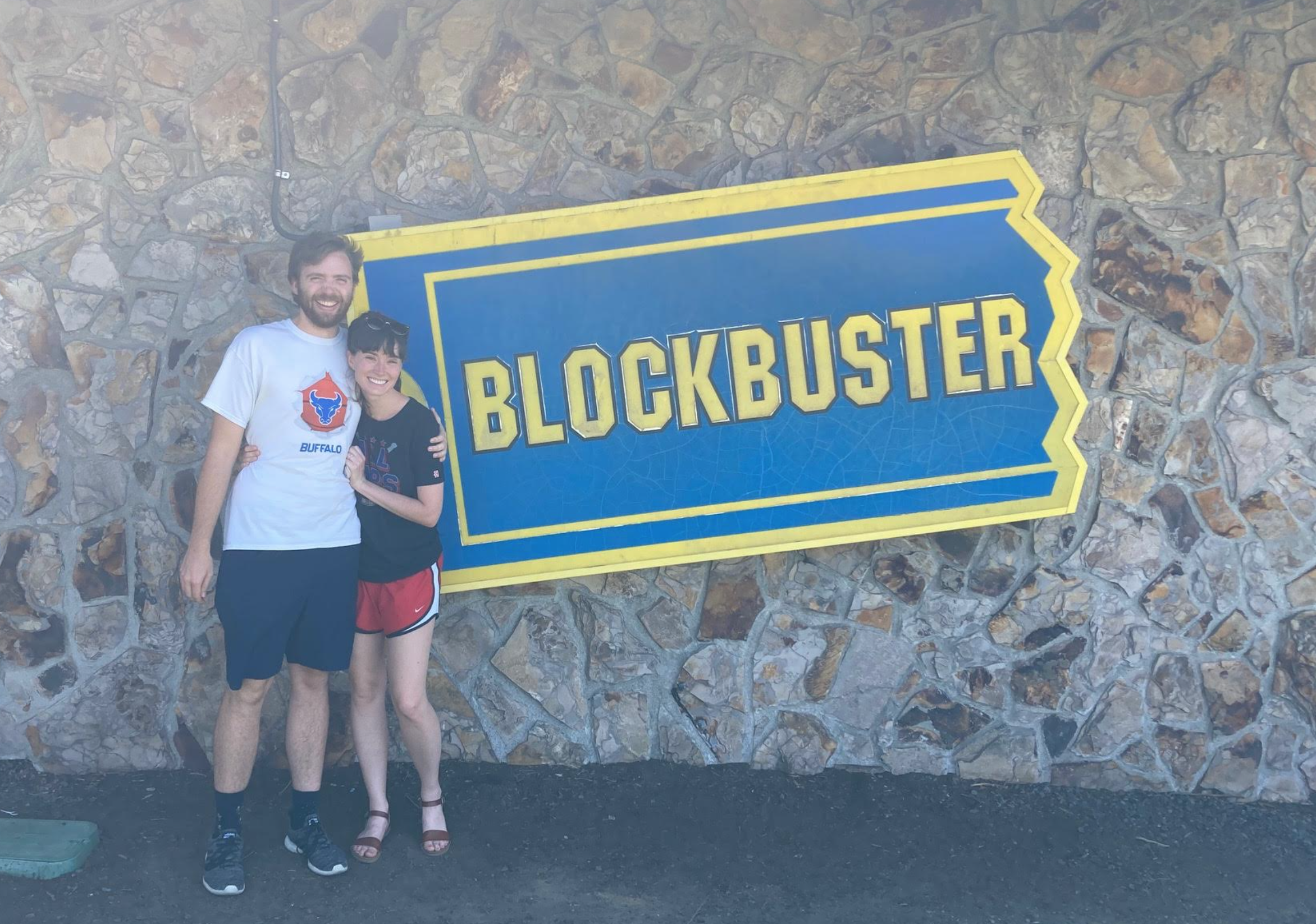 Couple standing outside Blockbuster