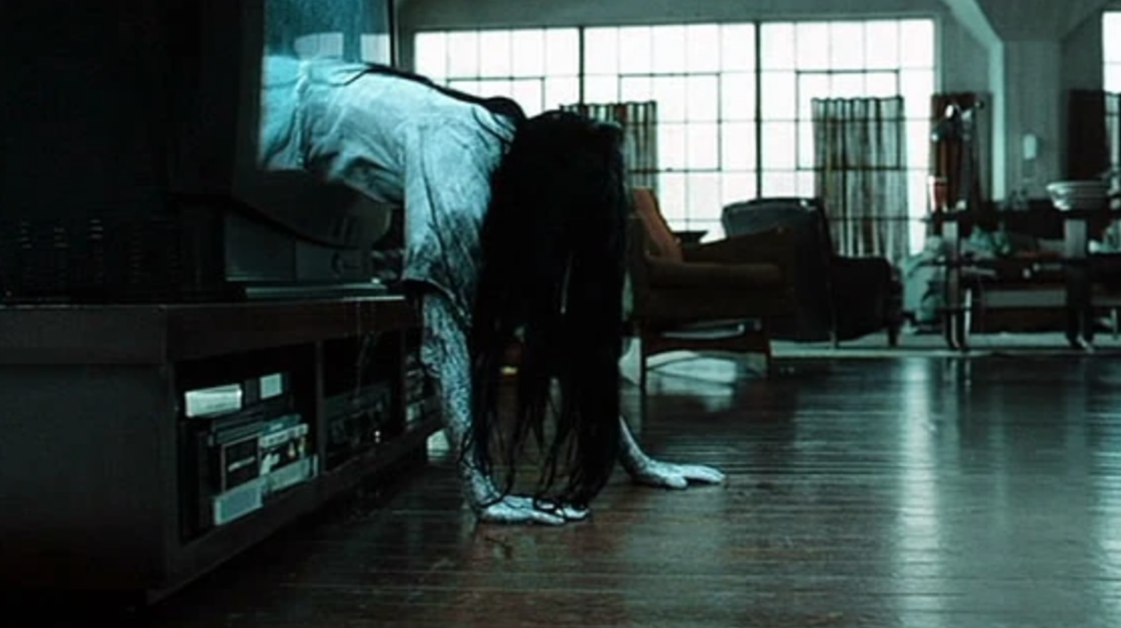 Girl emerging from TV