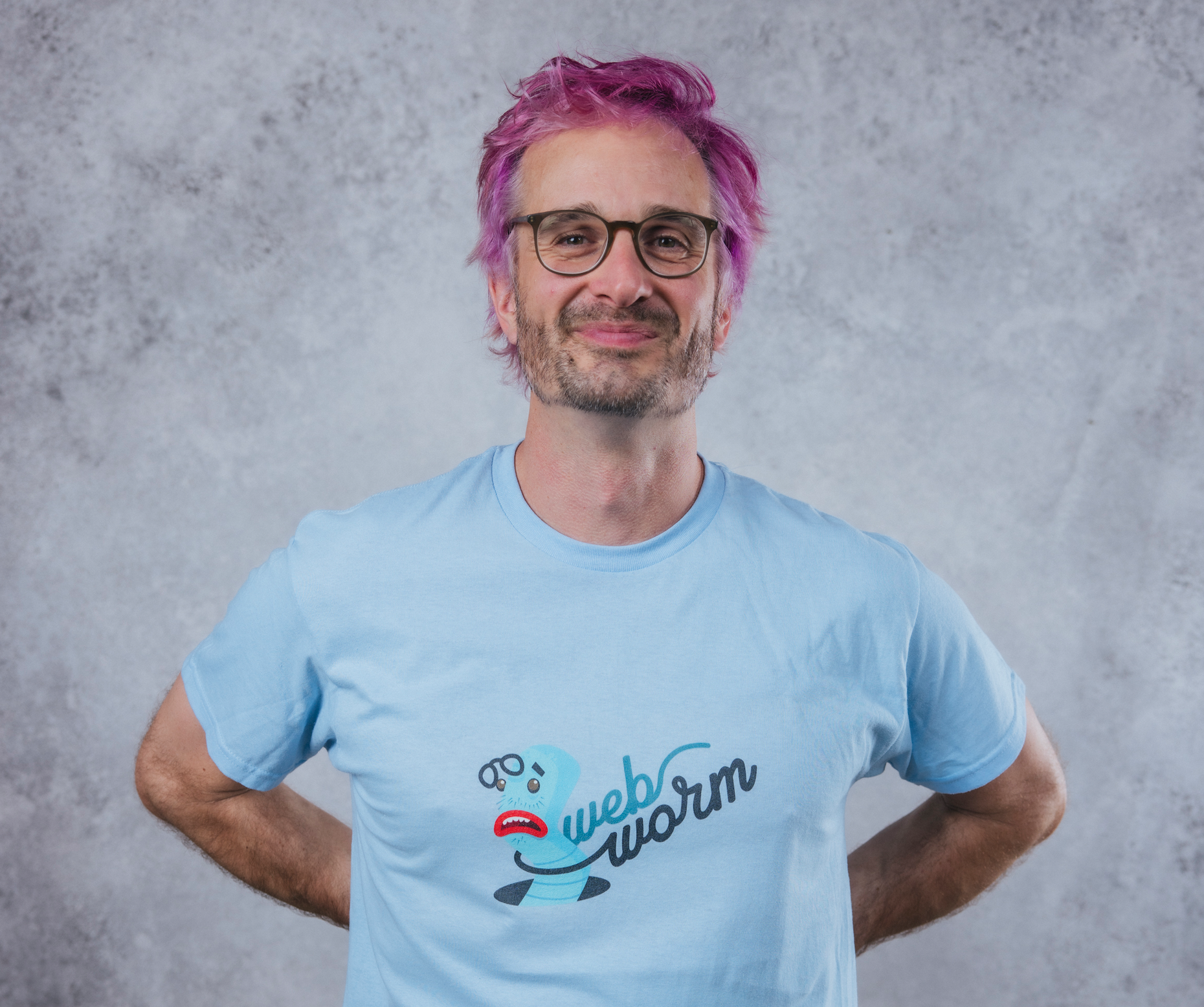 Blue tee shirt with classic Webworm logo on it